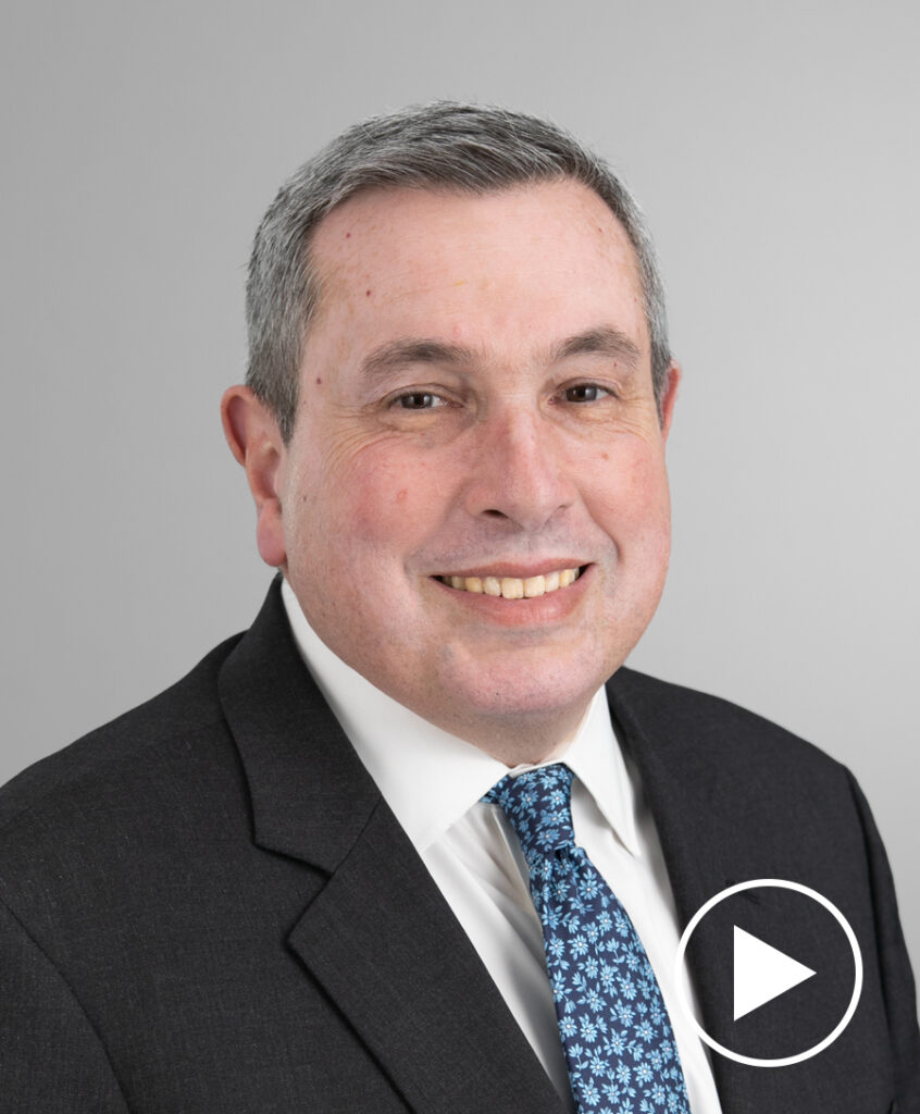 Photo of Julian Emanuel with play button