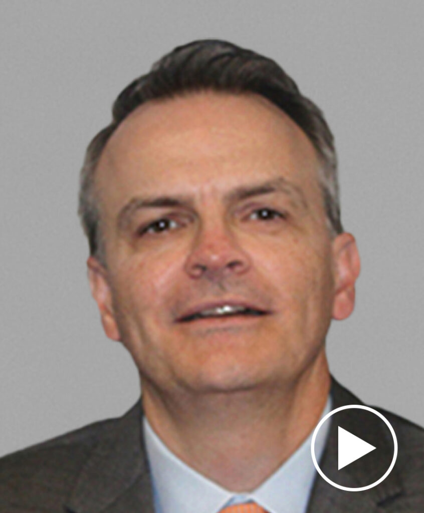 Photo of Thomas Gallagher with play button