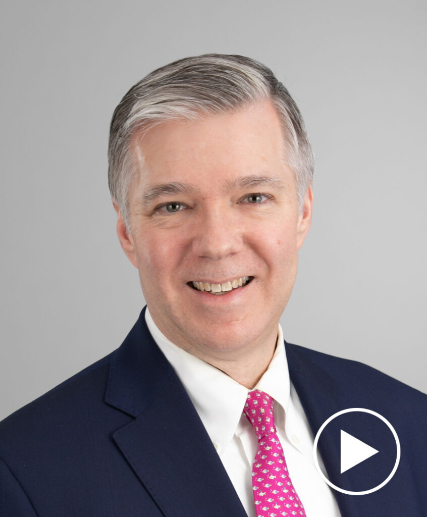 Photo of Greg Melich with play button