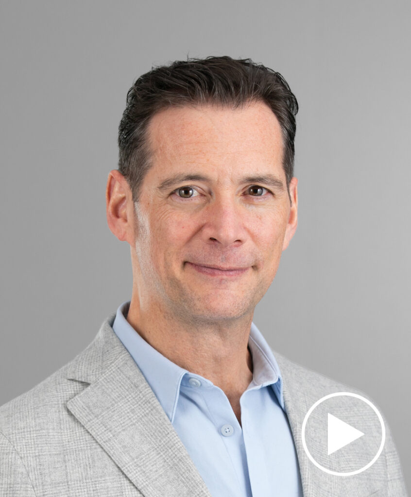 Photo of Rich Ross with play button